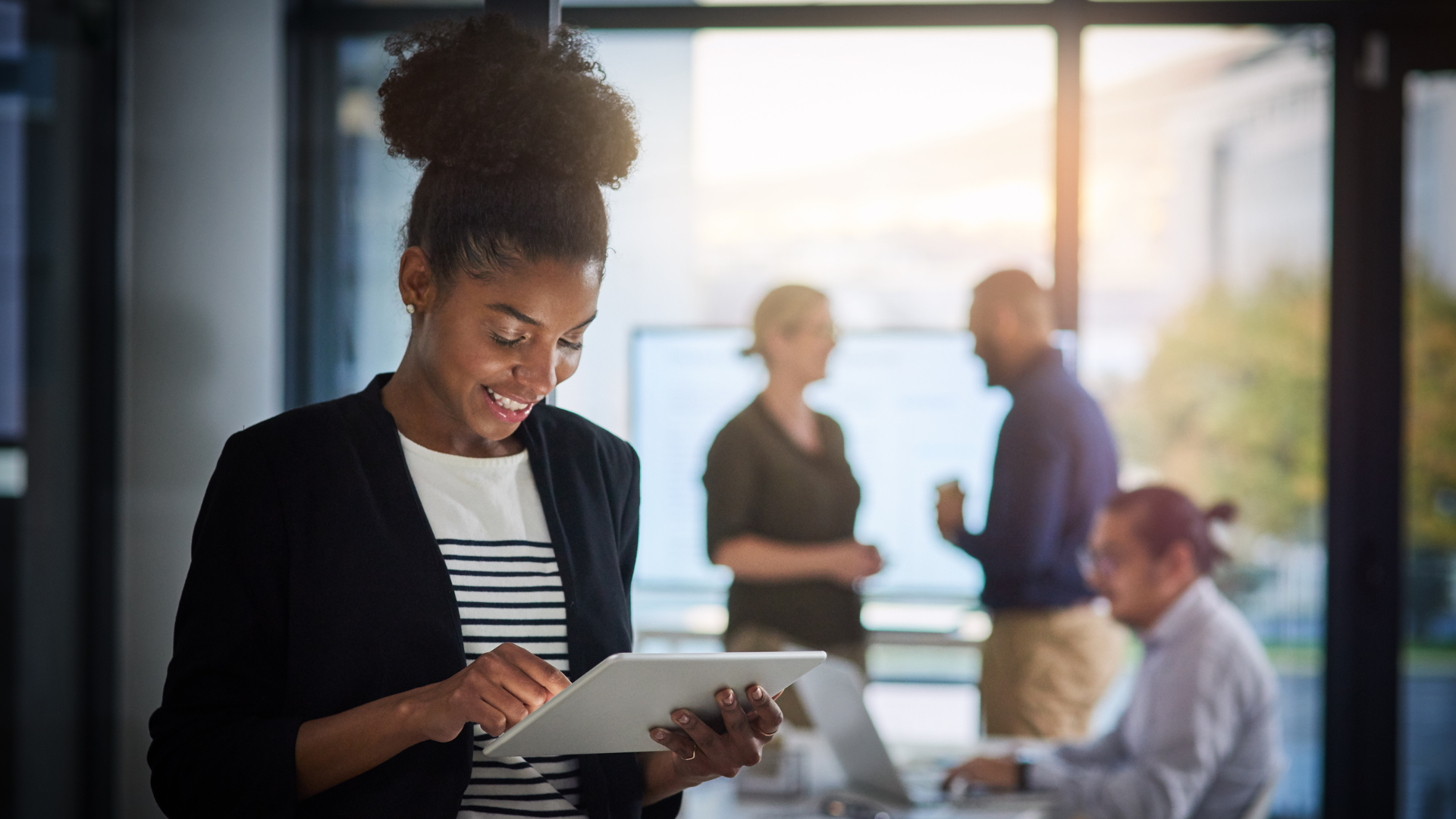 Woman using tablet in modern office